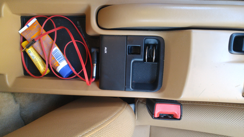 Under the armrest: Pro tip, use a 90 degree stereo adapter to get more useable space.